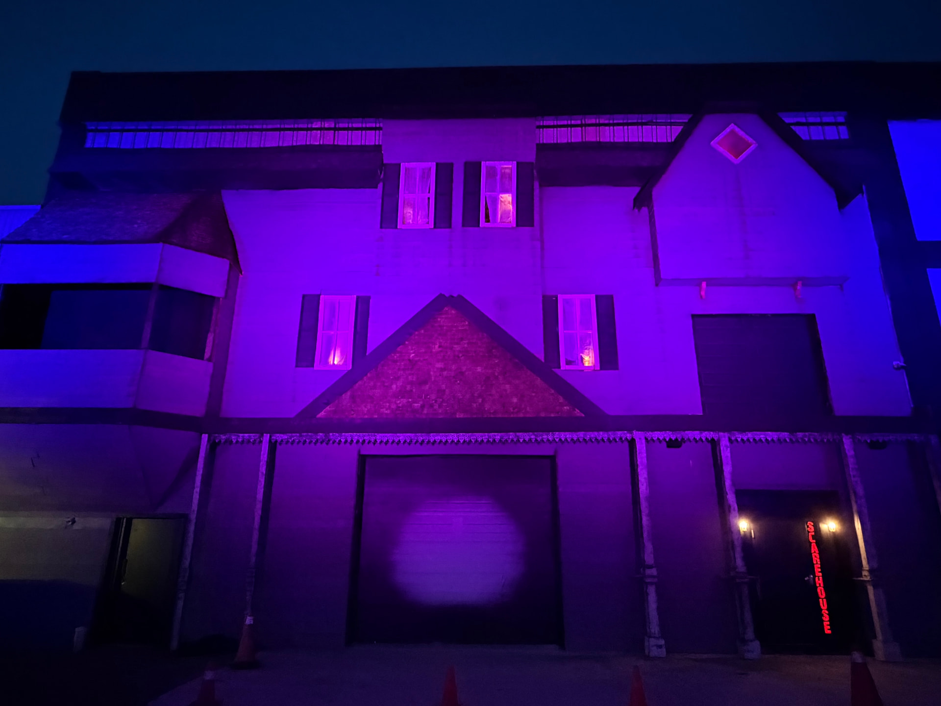 ScareHouse Windsor illuminated in purple and blue at night